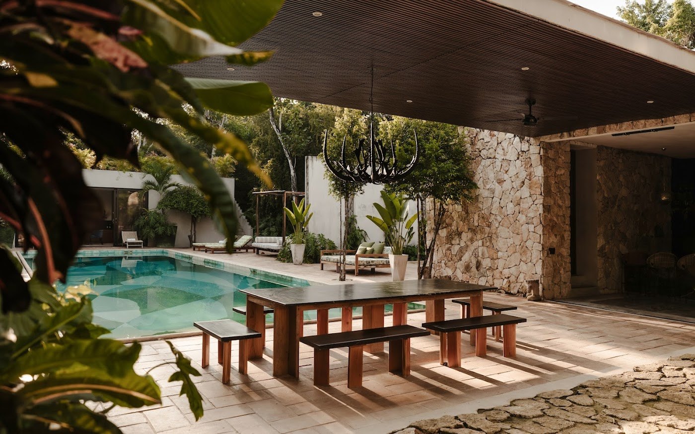 A long table by the pool — where the best nights at Casa Xolo tend to happen.